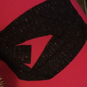 I’m selling black leggings with rainbow stars.